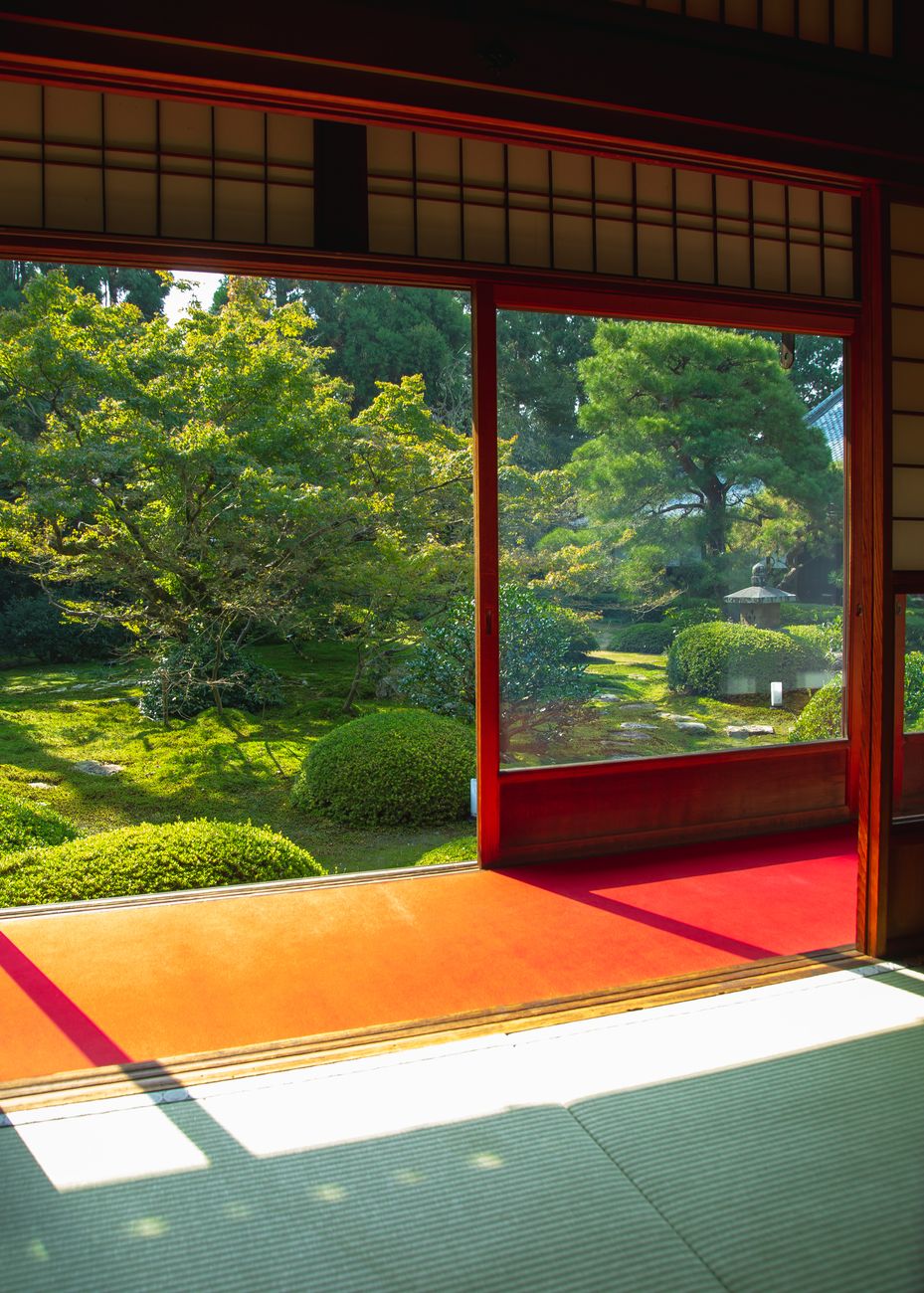 A serene courtyard garden in Kyoto viewed from an open engawa